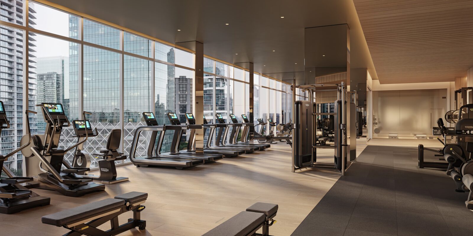 Technogym fitness center with floor-to-ceiling city views