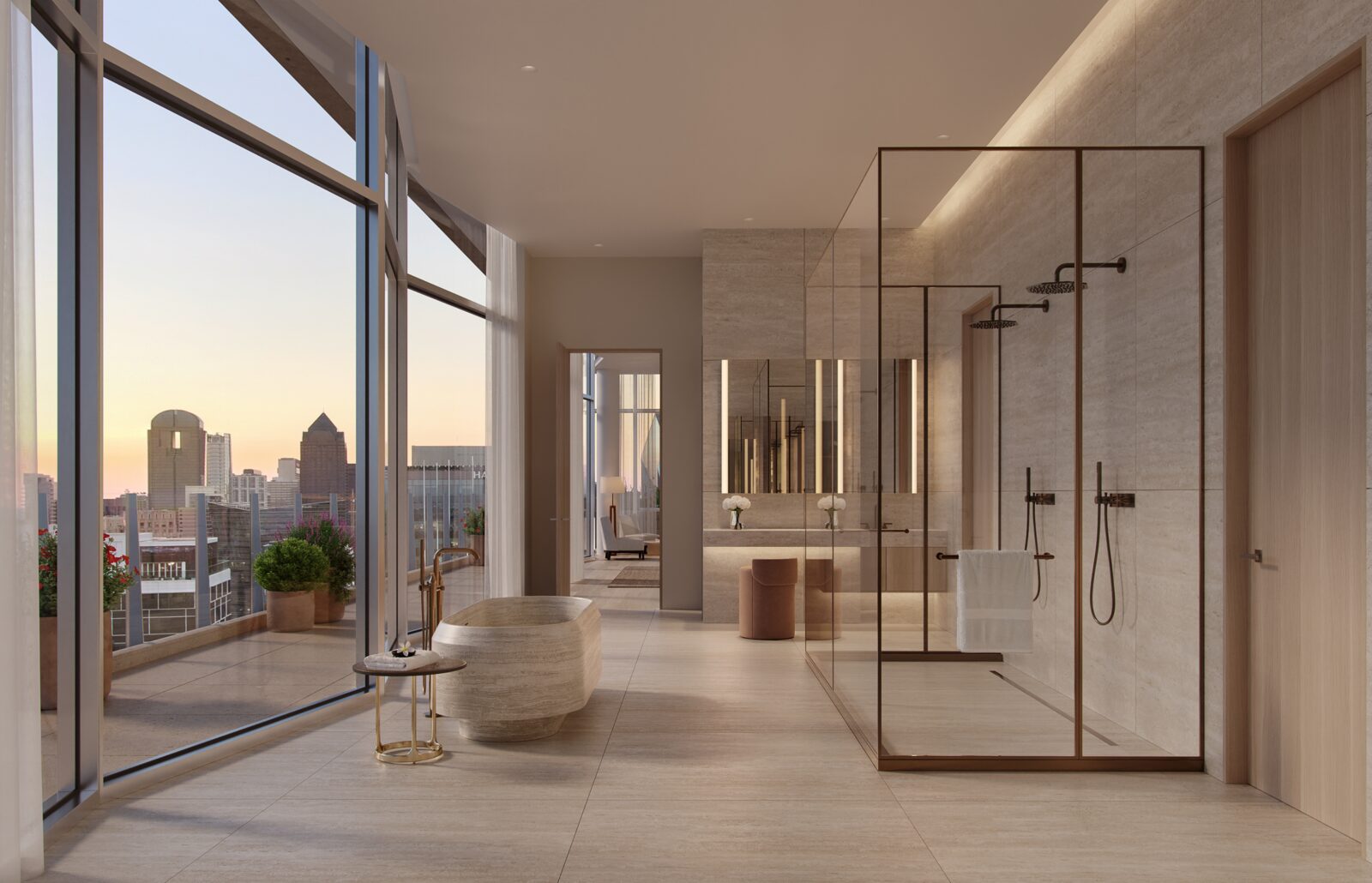 Penthouse bathroom with a freestanding tub and skyline views
