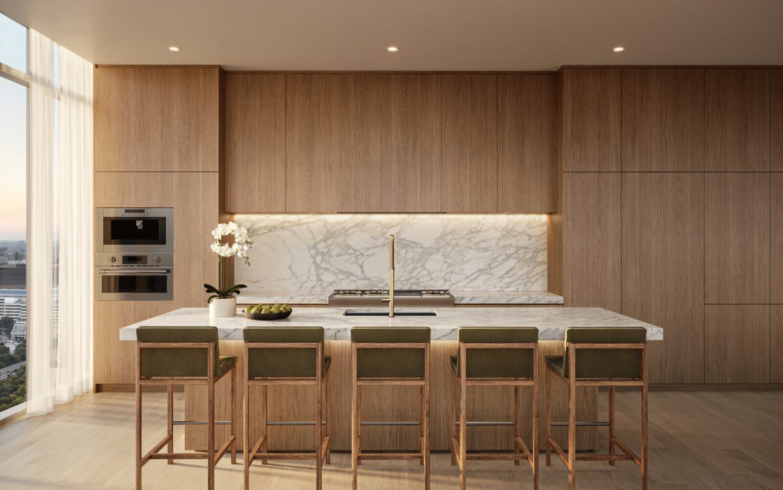 Chef kitchen with custom wood cabinetry and natural stone surfaces